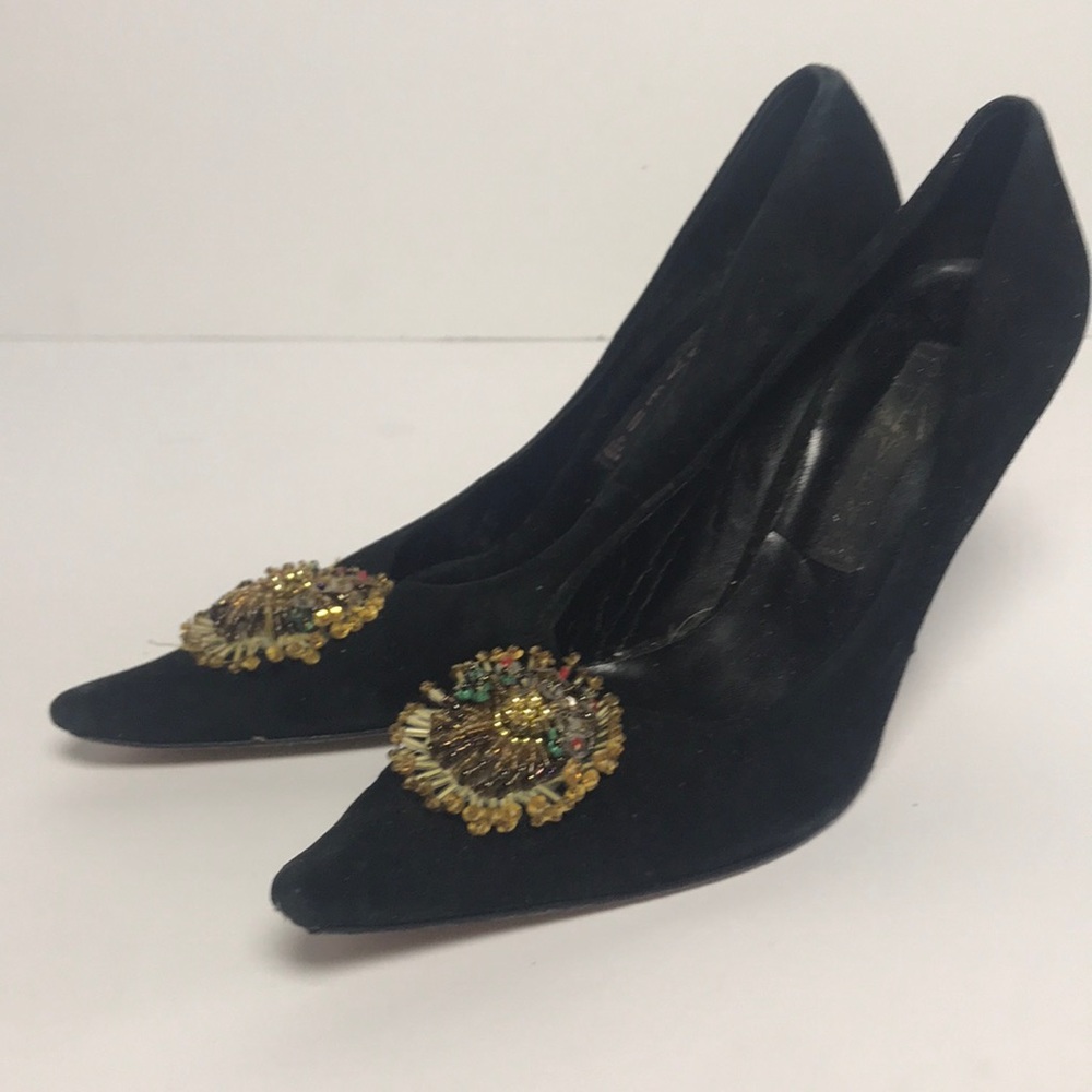 Black heels with needed decoration.